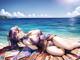 A woman laying on a beach next to the ocean.